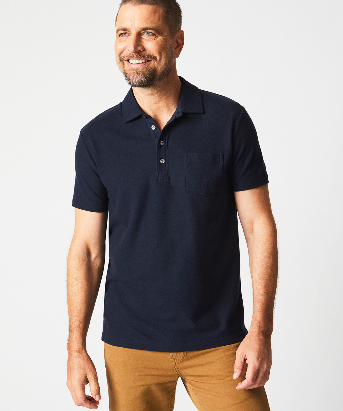 Model wears the Pique Pensacola Polo in Carbon Blue