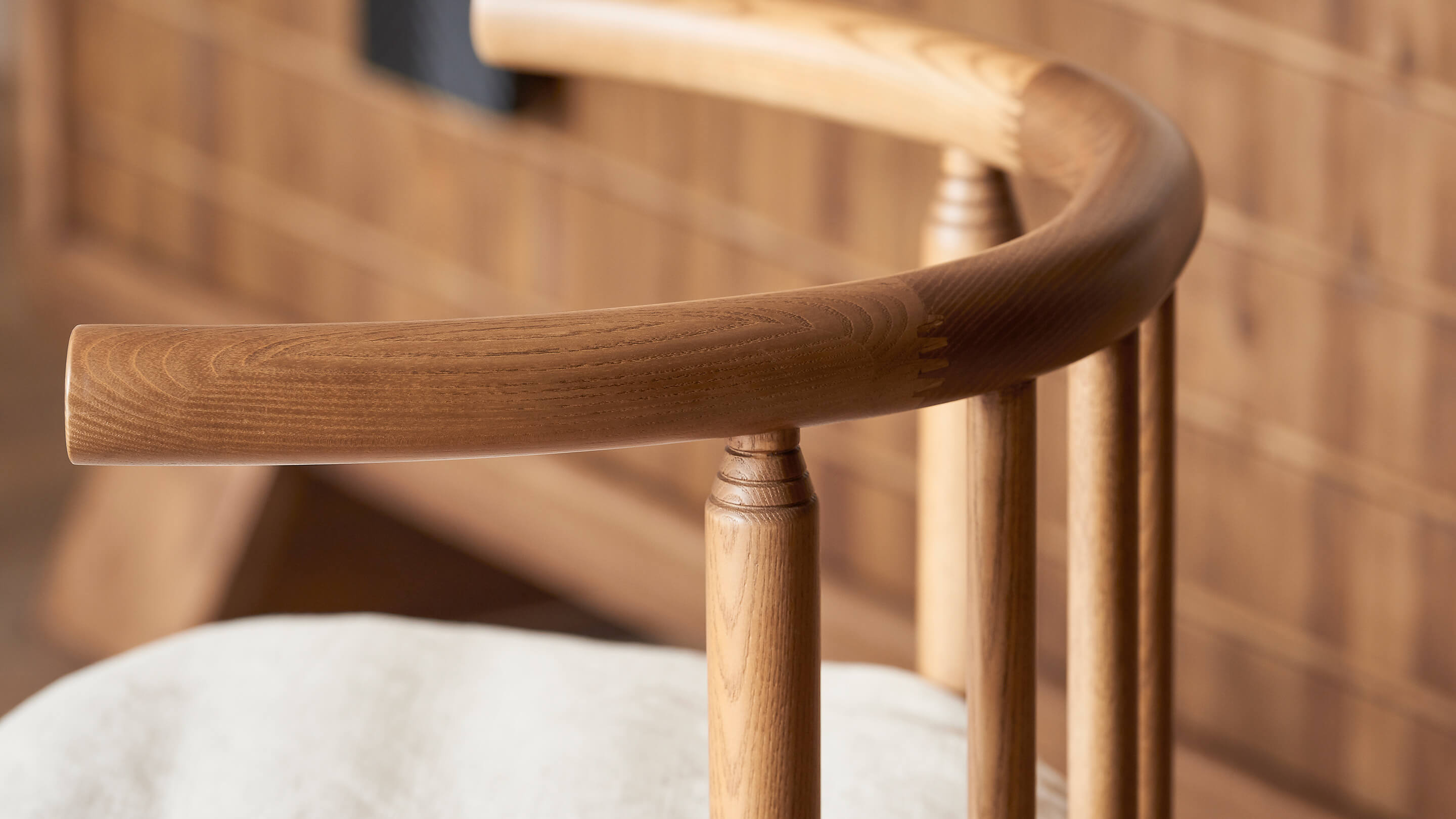 Close up view of the Heritage Ash frame of the Bene Dining Chair