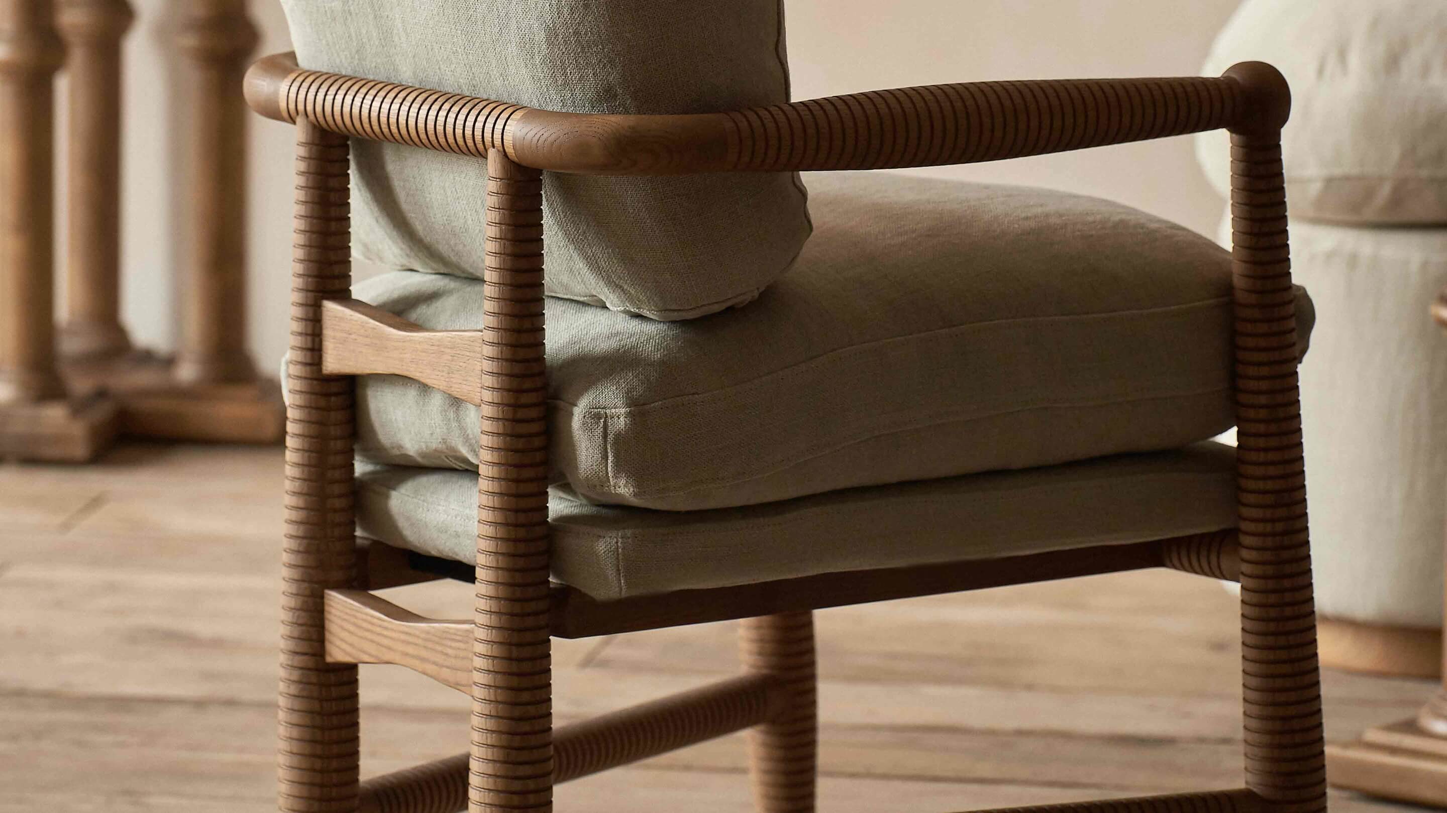 close up of the Gio Dining Chair Heritage Ash Frame, with Medium Weight Linen Jasmine Rice cushions