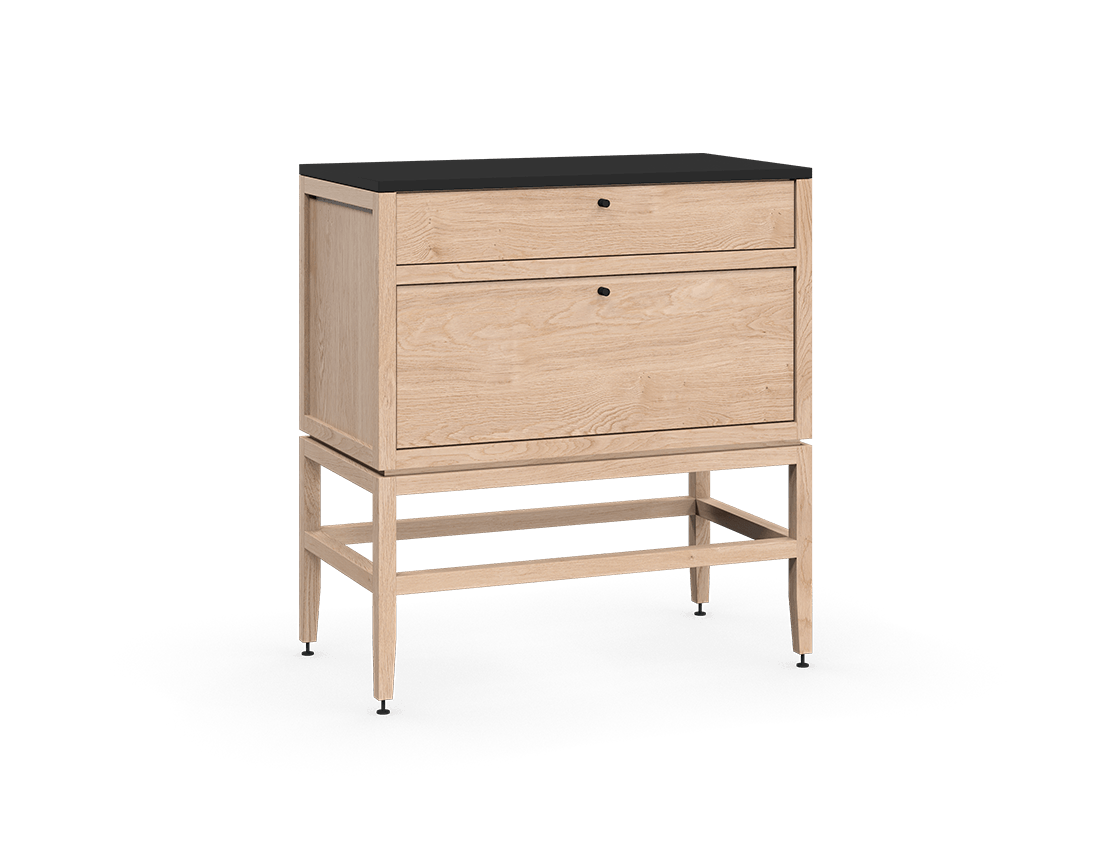 Coquo modular kitchen cabinet with two drawers in natural oak with metal handles.
