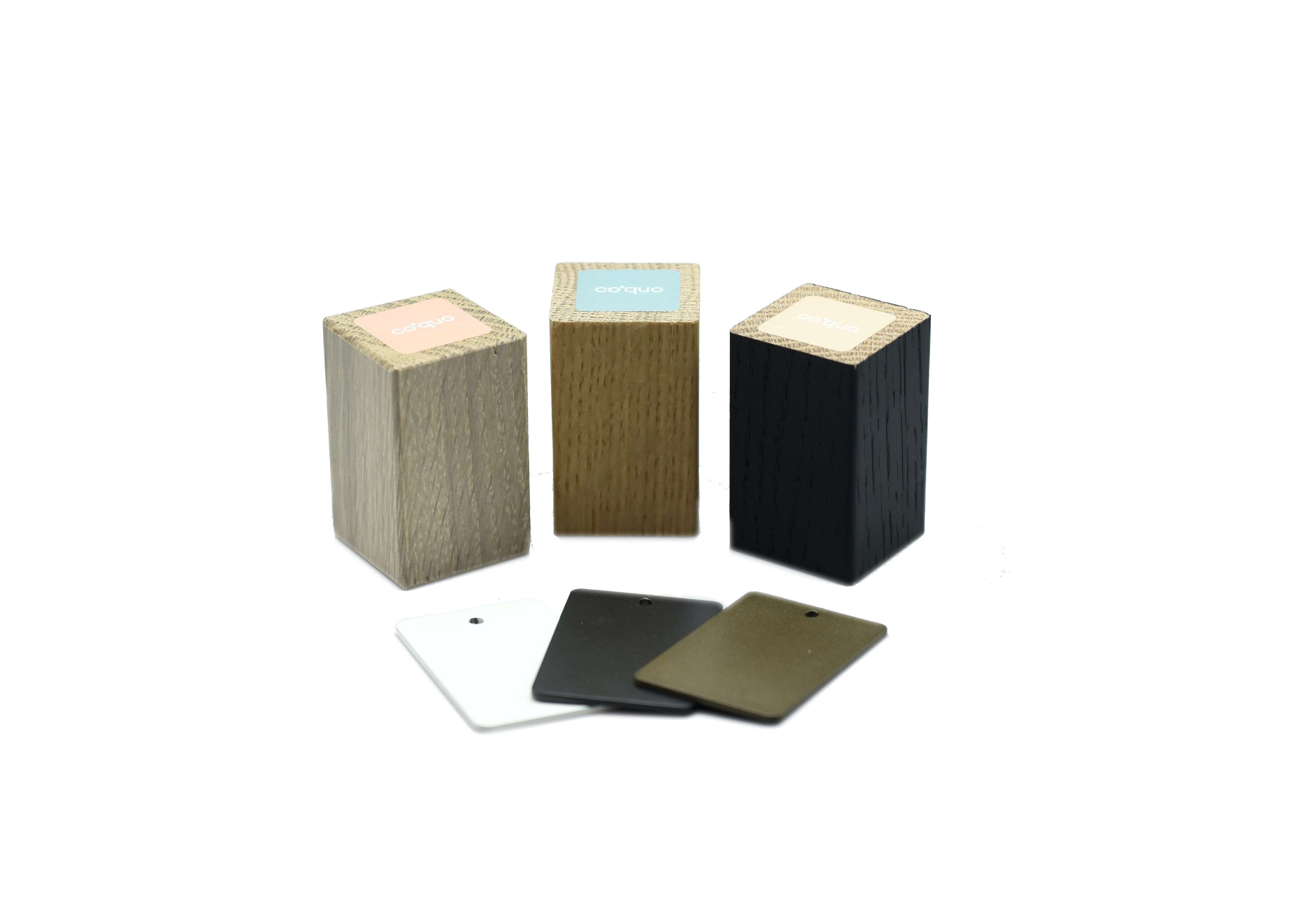 coquo sample kit that contains white stained oak, natural oak, black stained oak, white metal, black metal and bronze metal samples. 