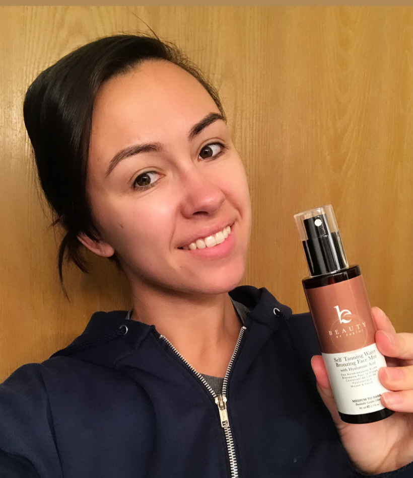 Alexis holding the Beauty By Earth Self Tanner Water Bronzing Face Mist 