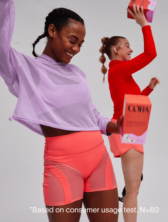 Two people holding boxes of the Made-to-Move Pads