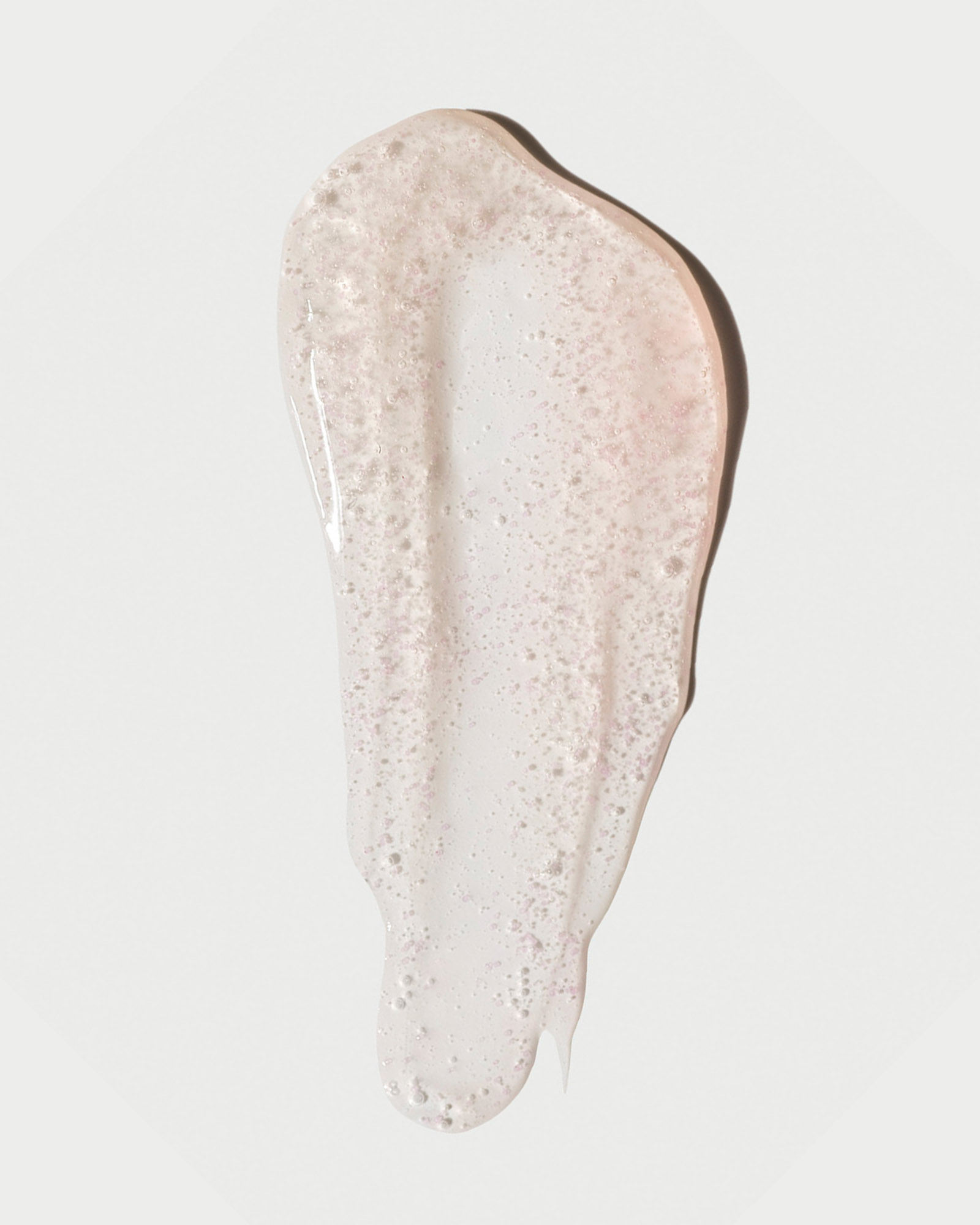 Formula swatch showcase the Rose Inc Skin Clarity Exfoliating Cleanser's Jojoba bead texture.