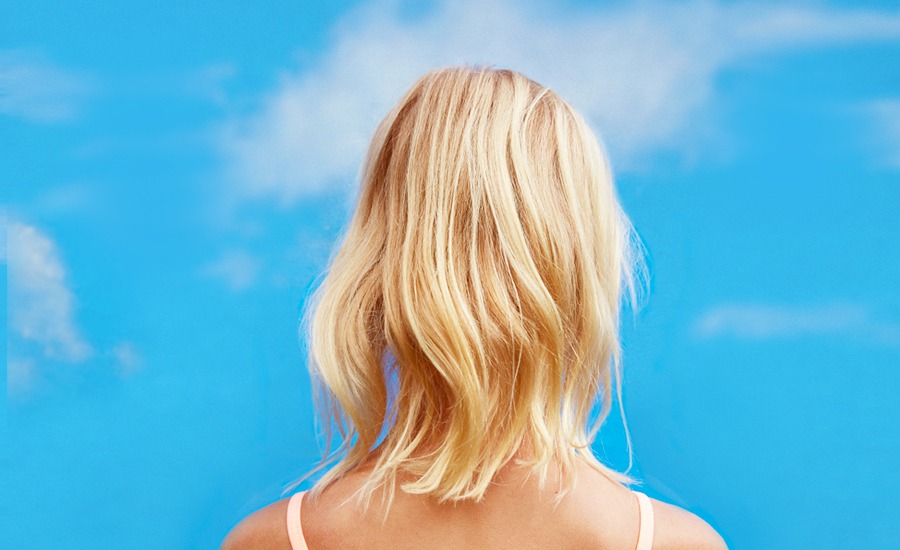 Wavy blonde hair after treatment.