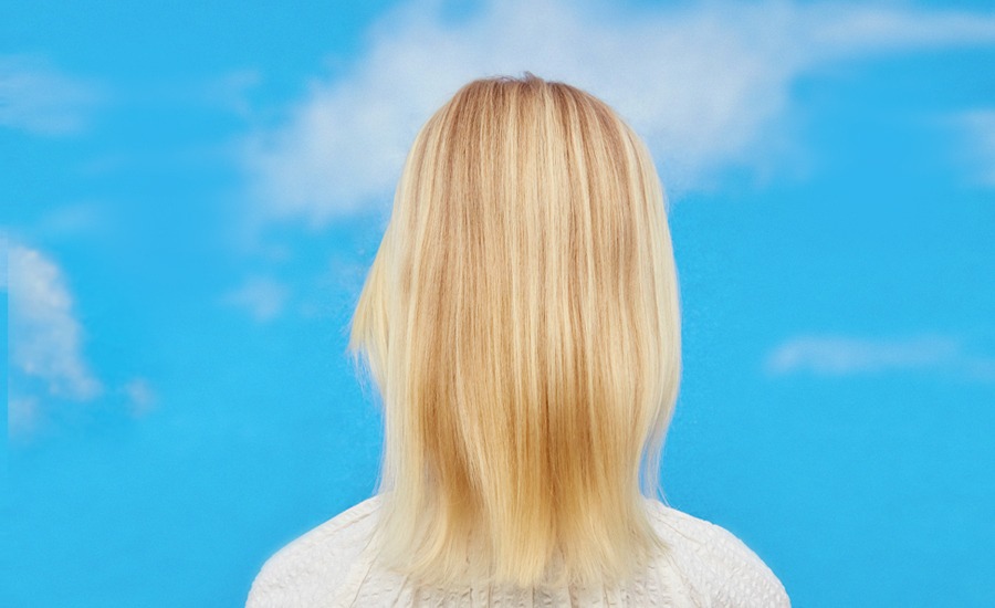 Straight blonde hair before treatment.