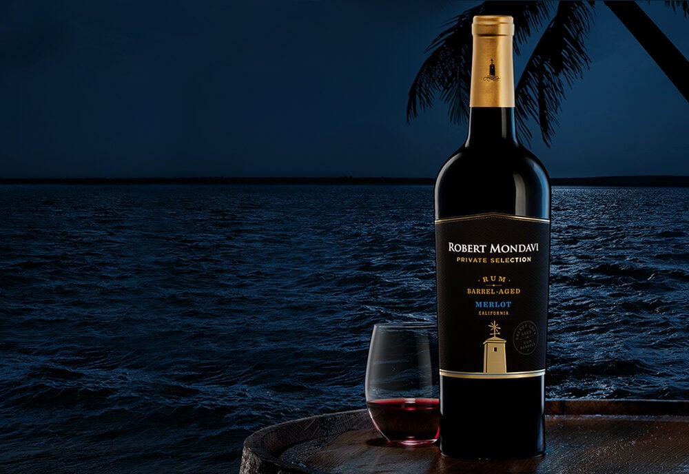 Our Rum Barrel-Aged Merlot blends the familiar with the exotic. The cool climate of our coastal vineyards imparts the wine with jammy flavors of plum and blueberry. Select lots are then aged in Rum barrels, delivering complex nuances of toasted coconut, molasses, and rich vanilla when added to the blend.