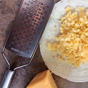 Why you should grate your own cheese by hand?