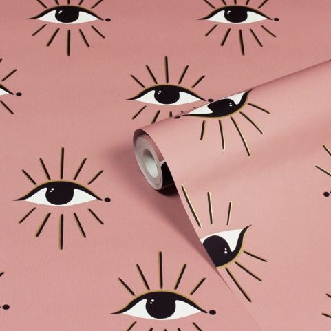 roll of pink wallpaper with abstract eye design theia