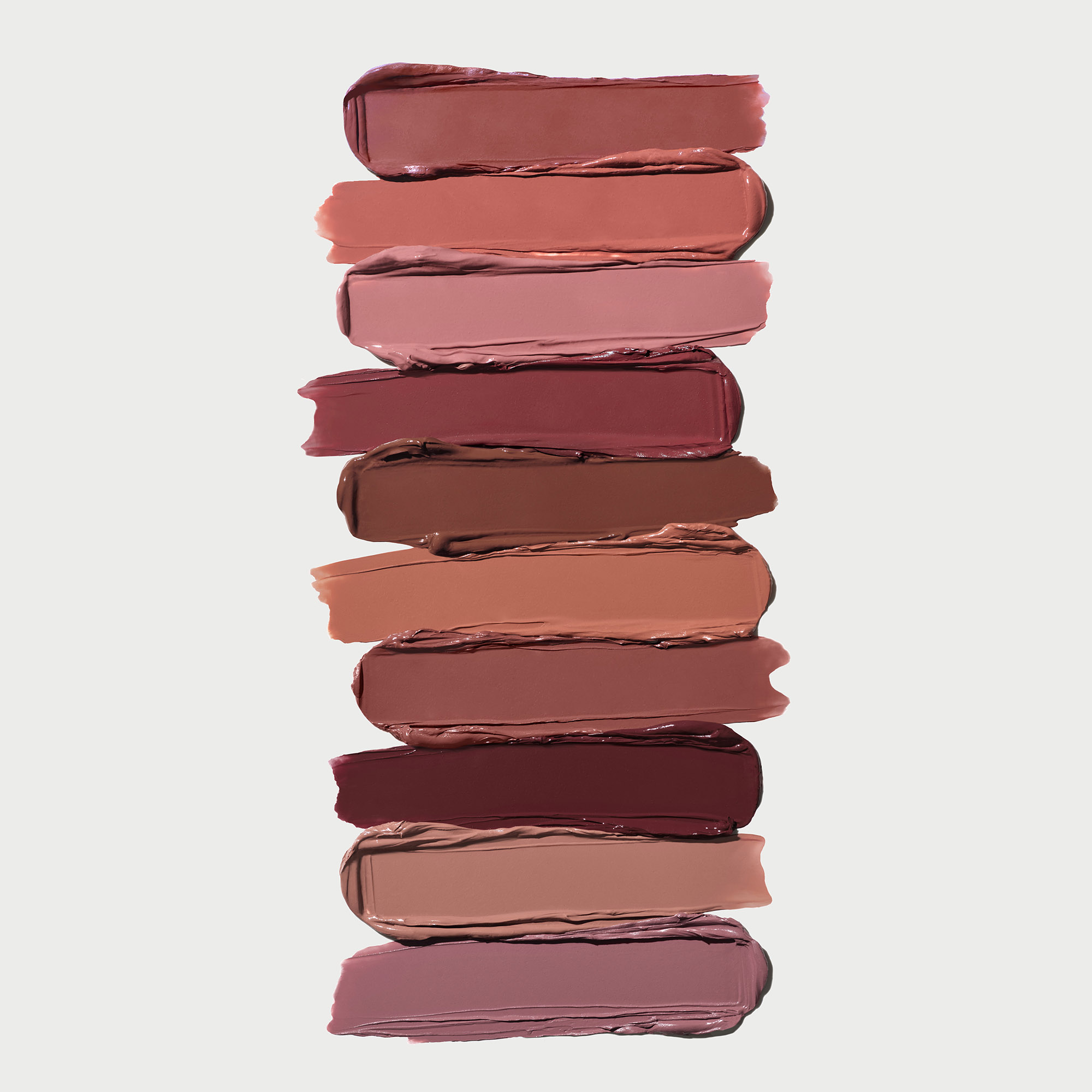 Image of stacked Satin Lipstick Swatches to show the range of color from berry, mauve and neutral hues. Desktop