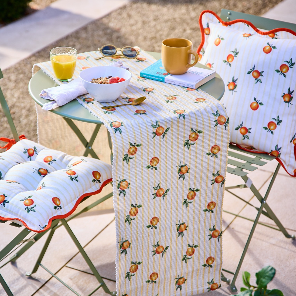 Orange outdoor seat pads and table runner