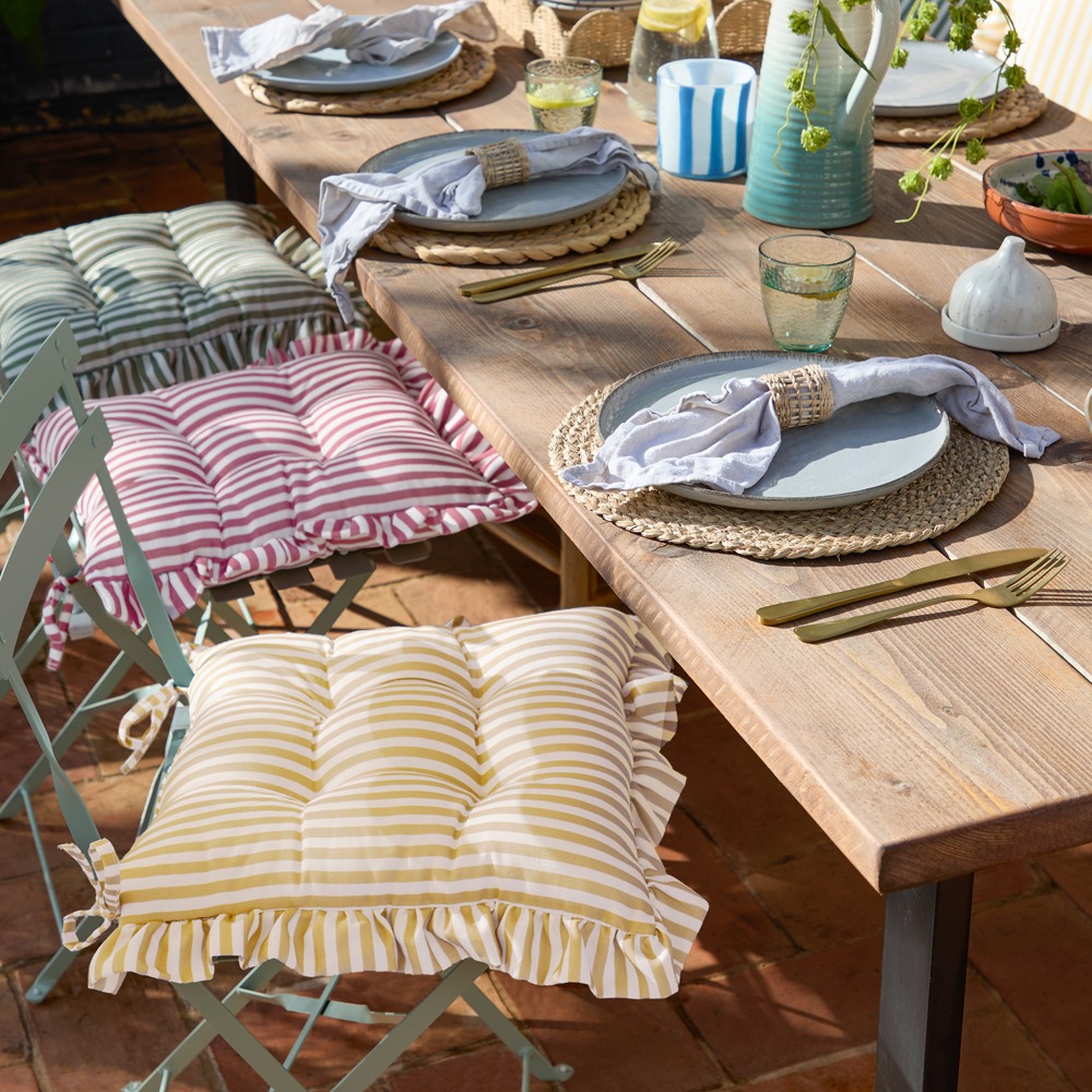 Striped outdoor cushions with frills