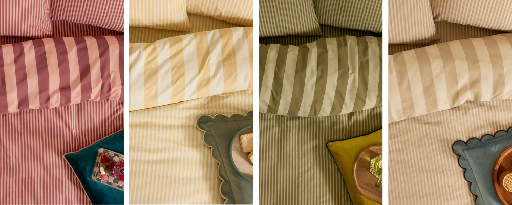 A close up of four different coloured striped beddings, a pink striped bedding, a yellow striped bedding, a green striped bedding and a neutral striped bedding