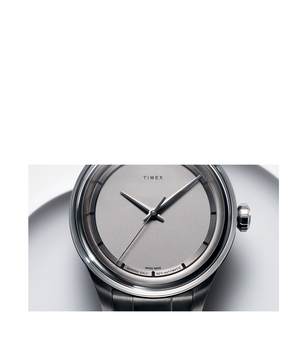 A detailed view of the Giorgio Galli S2Ti Swiss Made Automatic watch, featuring a minimalist grey dial with a sleek design, titanium case, and precision-crafted hands. The watch face is marked with