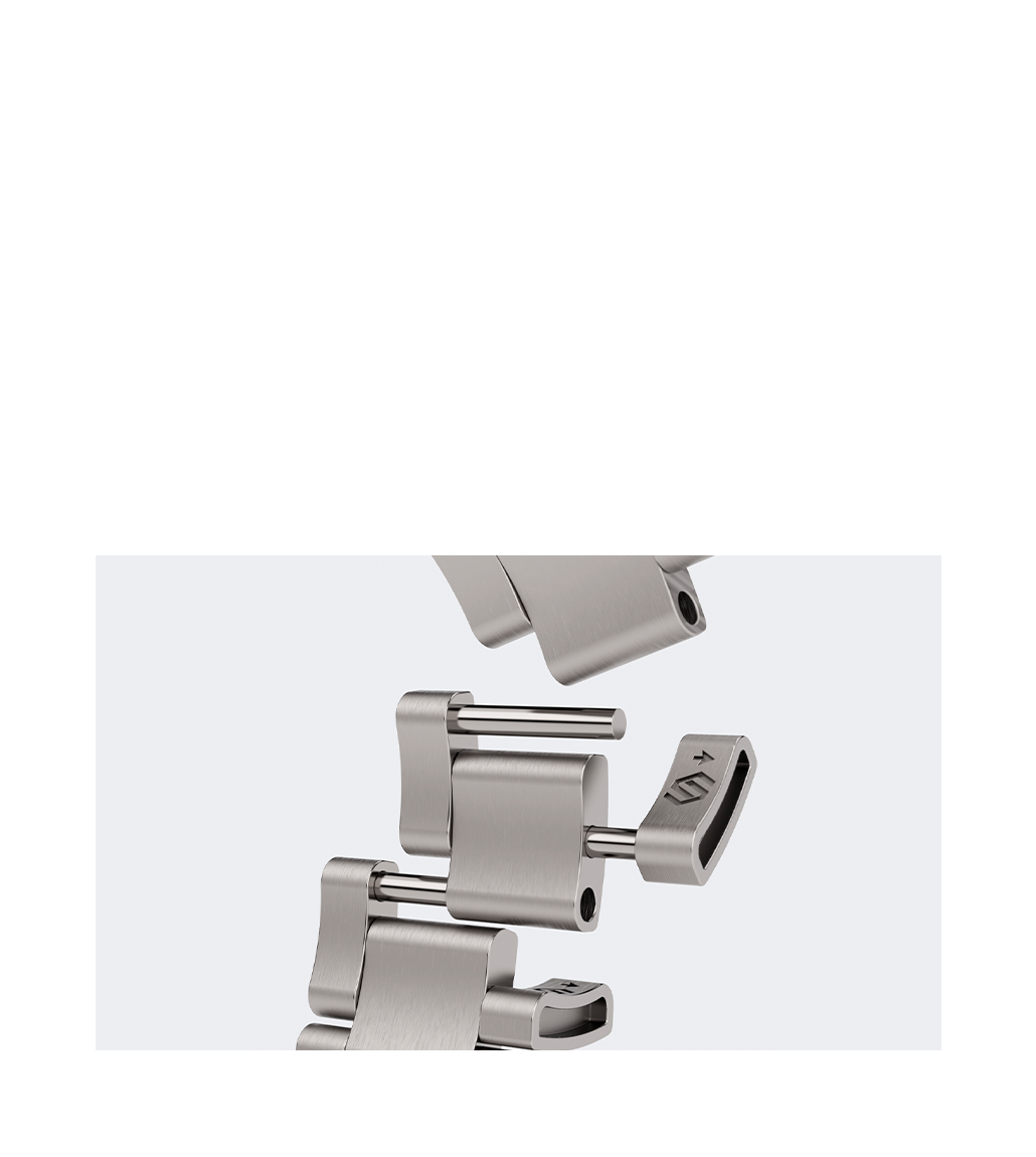 A breakdown of the titanium bracelet links, highlighting the precise engineering, smooth brushed finish, and secure locking mechanism with a signed clasp.