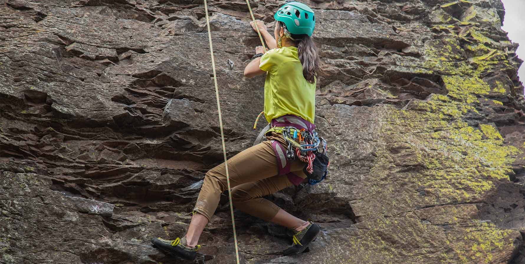 Women wearing the Tinkham Pants by Beyond Clothing while rock climbing the Feathers at Frenchman Coulee. 