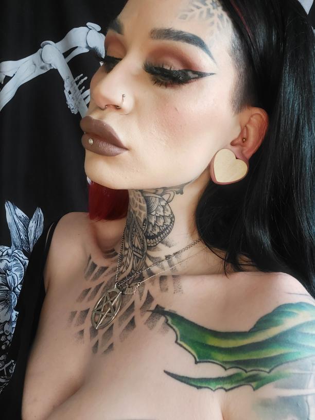 Tattooed girl wearing  Crocodile Heart Shaped Wood Ear Plug / Gauge