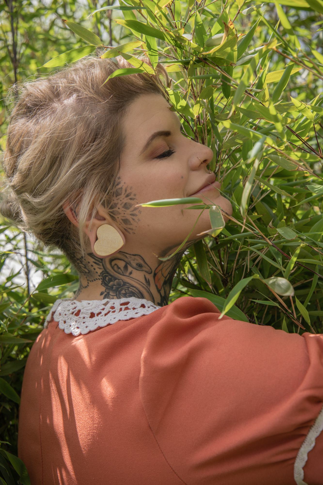 Female wearing pretty  Crocodile Heart Shaped Wood Ear Plug / Gauge