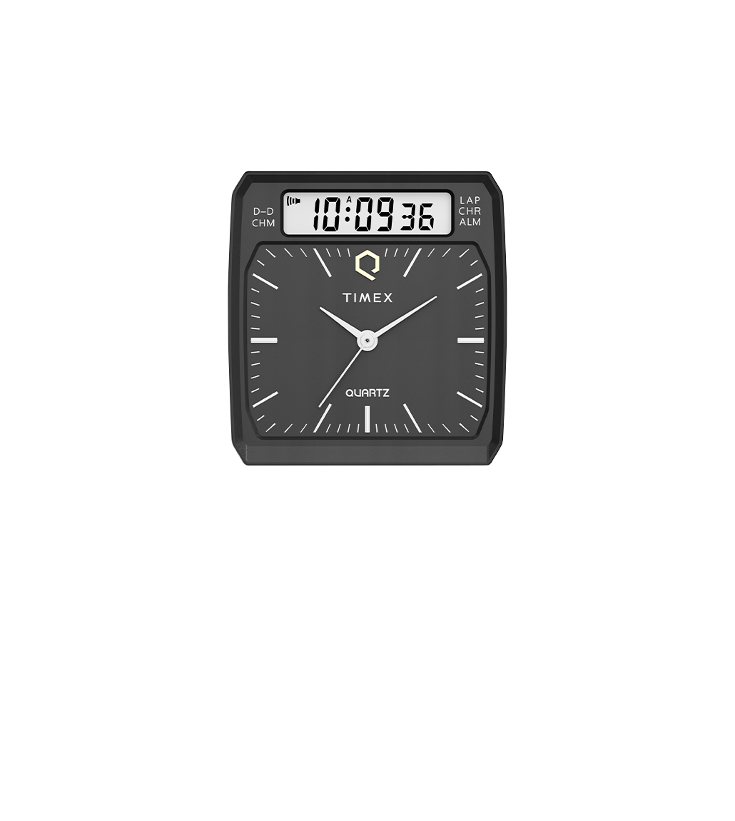 A close-up of the Q Timex® 1982 Ana-Digi Reissue watch dial detached from the bracelet, featuring a black face with analog hour and minute hands, a digital display at the top, and a retro-style design.