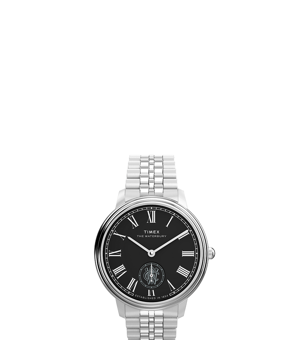 A front-facing view of the Timex Waterbury Metropolitan Sub-Second wristwatch, featuring a black dial with silver Roman numerals, a stainless steel bracelet, and a sub-second dial positioned at 6 o’clock.