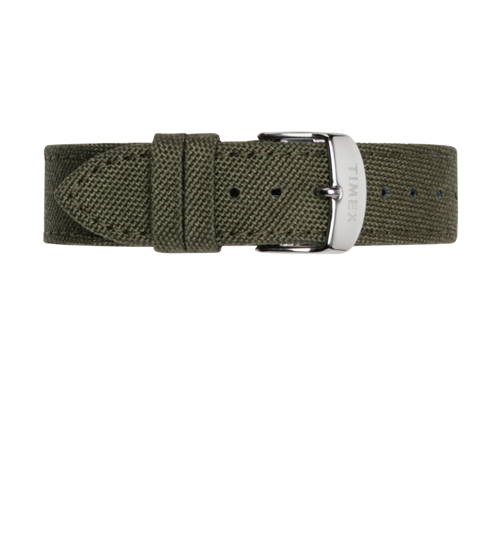 Close-up of the olive green fabric watch strap with silver-tone buckle, engraved with the Timex logo, laid flat on a white background.