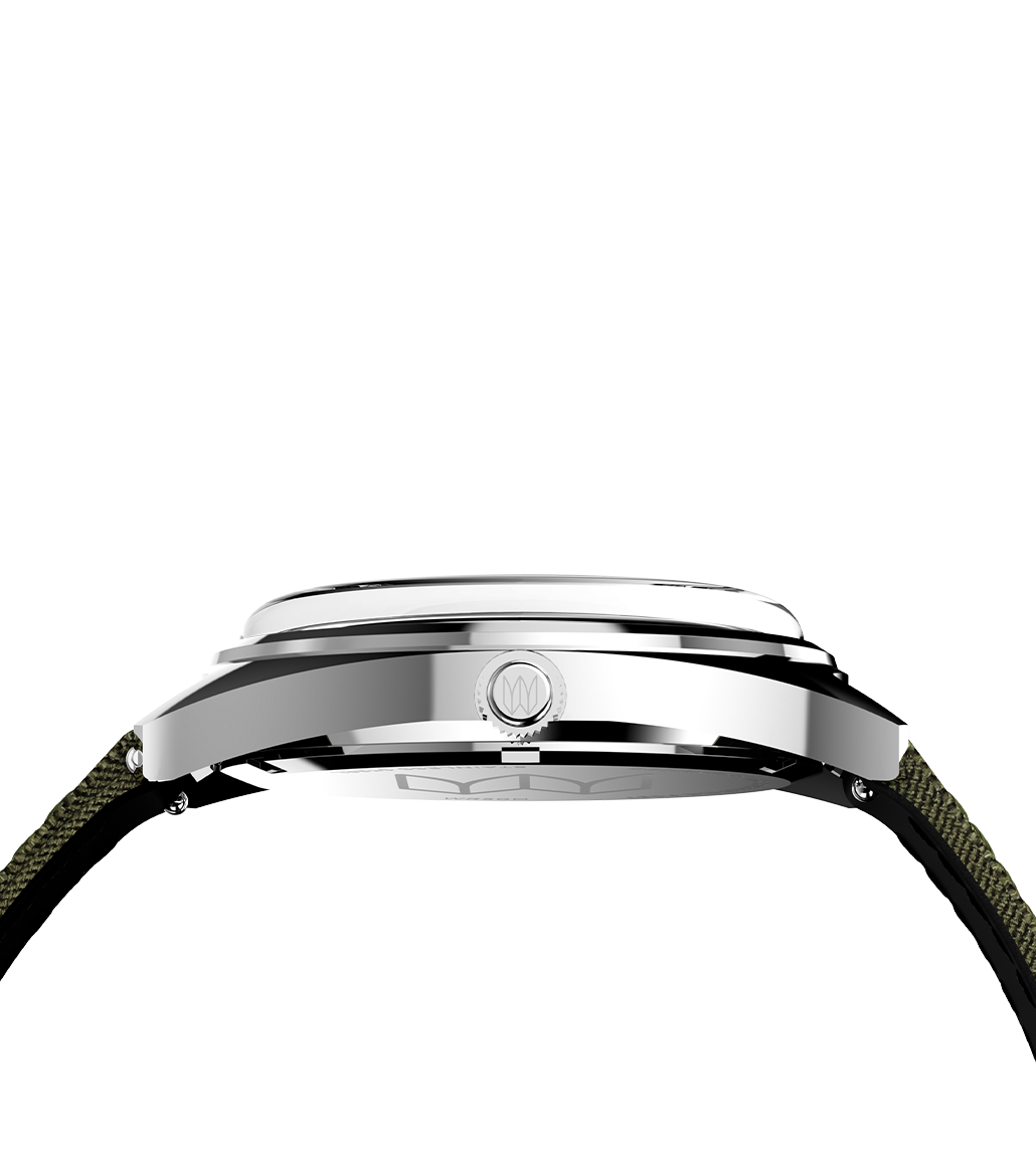Side profile of the Timex x Bespoke Post watch showing the polished stainless steel case and crown, revealing its domed crystal and sleek cushion-shaped design.