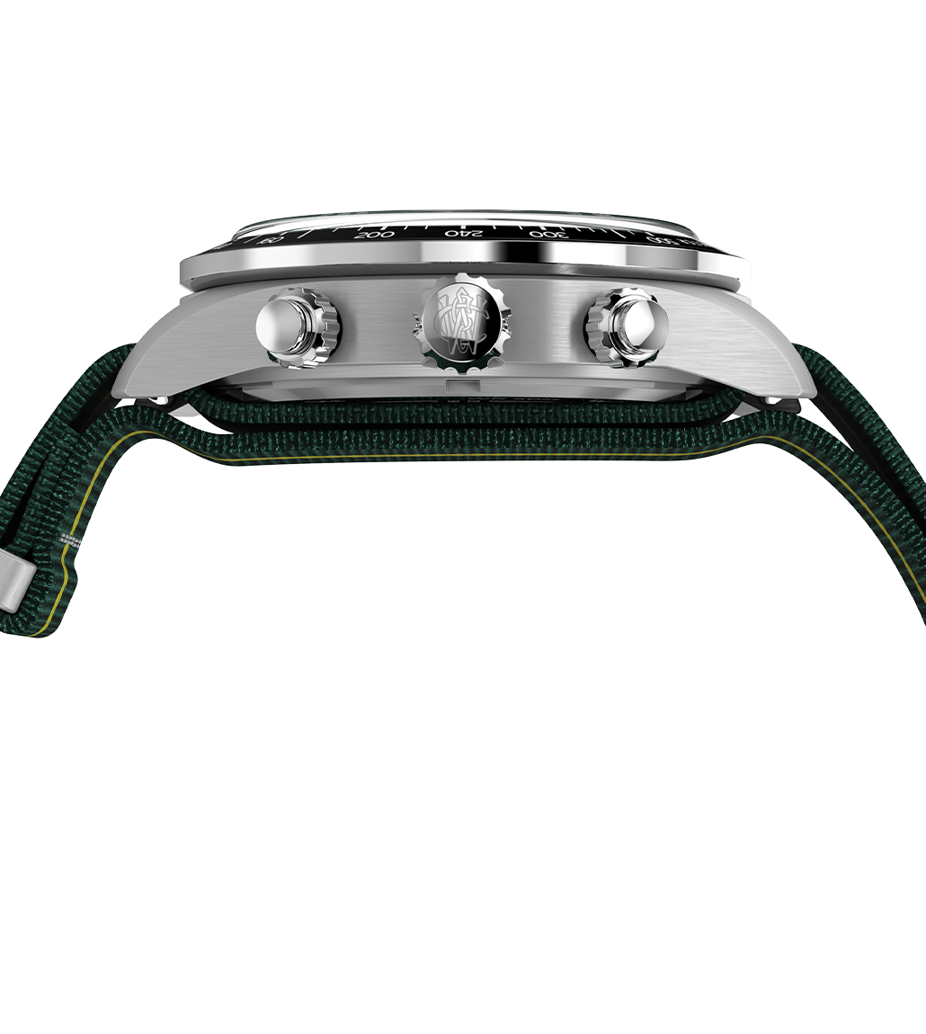 Side view of the Timex Waterbury Heritage Chronograph displaying its brushed stainless steel case, signed crown with Waterbury “W” emblem, chronograph pushers, and a slightly domed crystal over the bezel.