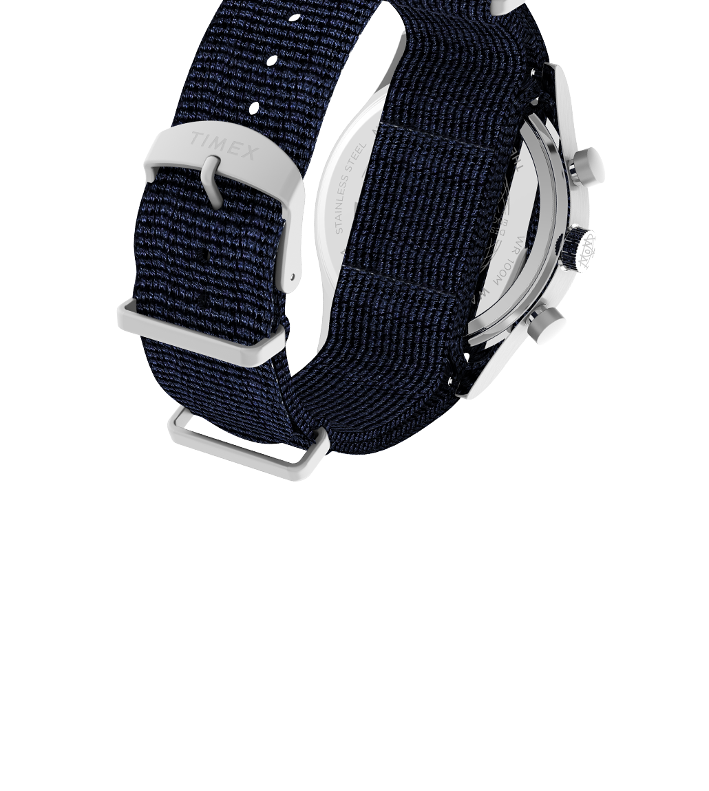 Angled rear view of the Waterbury Fly-back Chronograph showcasing the navy-blue woven strap with a stainless steel buckle engraved with “TIMEX.” The shot reveals part of the chronograph pushers and case back, emphasizing the rugged yet refined build quality.