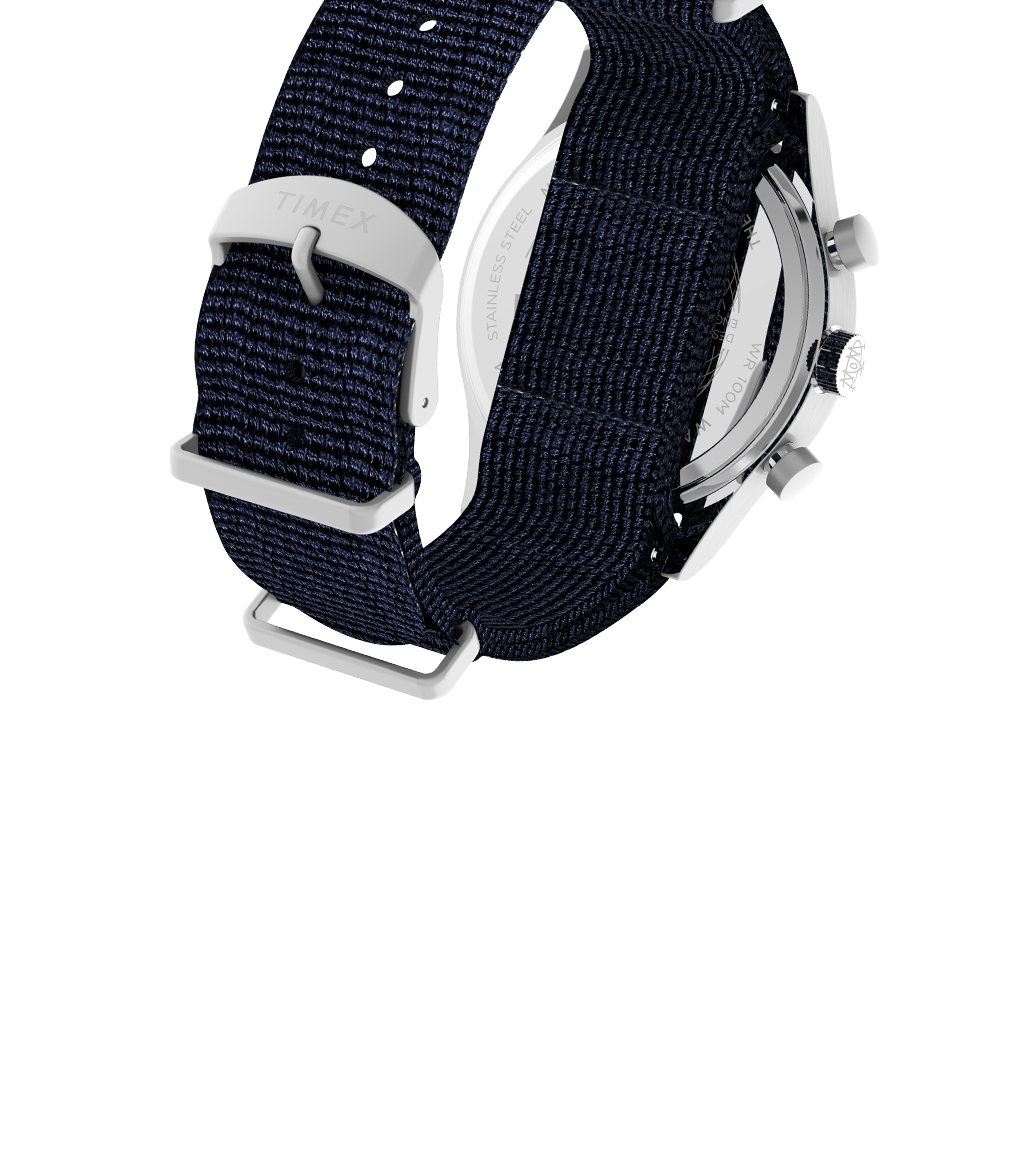 Angled rear view of the Waterbury Fly-back Chronograph showcasing the navy-blue woven strap with a stainless steel buckle engraved with “TIMEX.” The shot reveals part of the chronograph pushers and case back, emphasizing the rugged yet refined build quality.