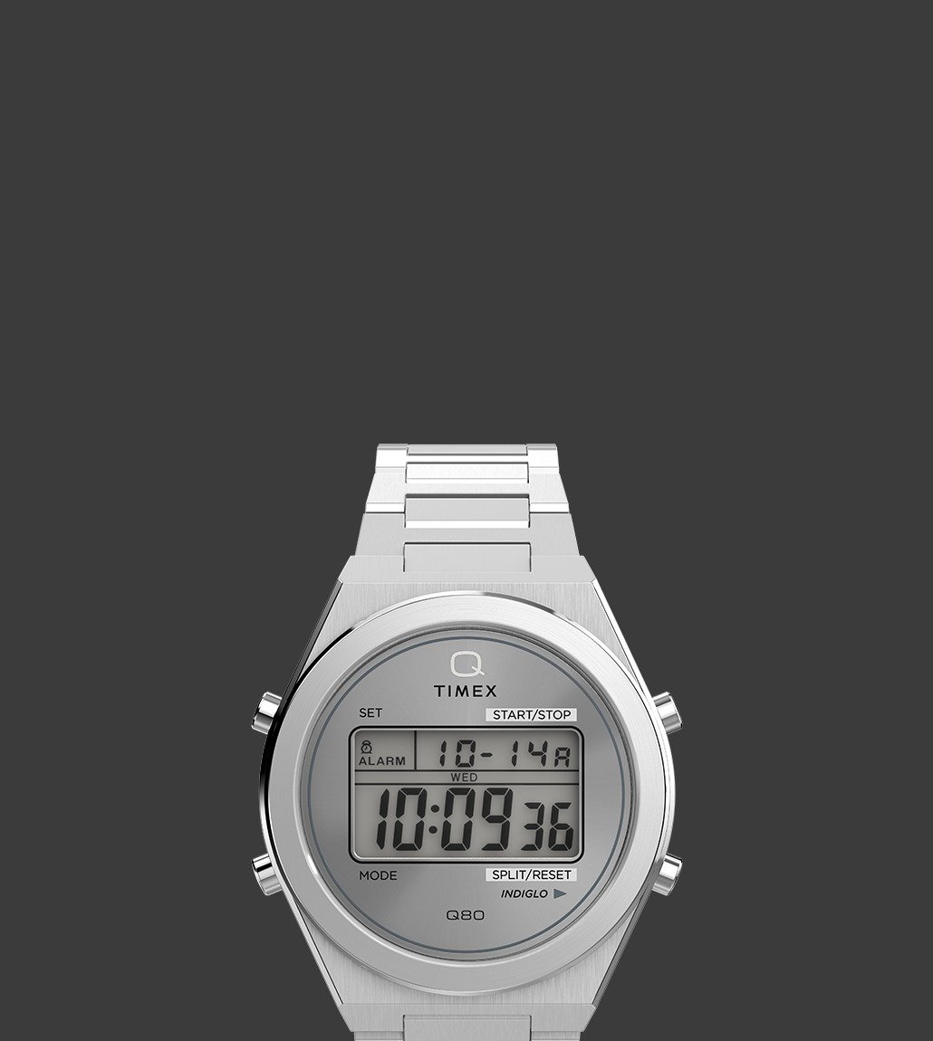 Q Timex® Q80 Continental with a clean silver-tone case and bracelet, showcasing digital features on a grey-toned display.