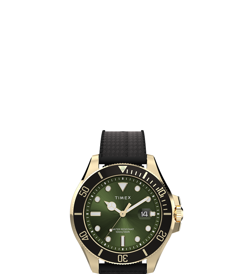 A product shot of the Timex Harborside Coast watch with a sunray green dial, gold-tone case, and black silicone strap. The dial features circular and rectangular luminous markers, bold hour and minute hands, and a magnified date display at 3 o’clock.