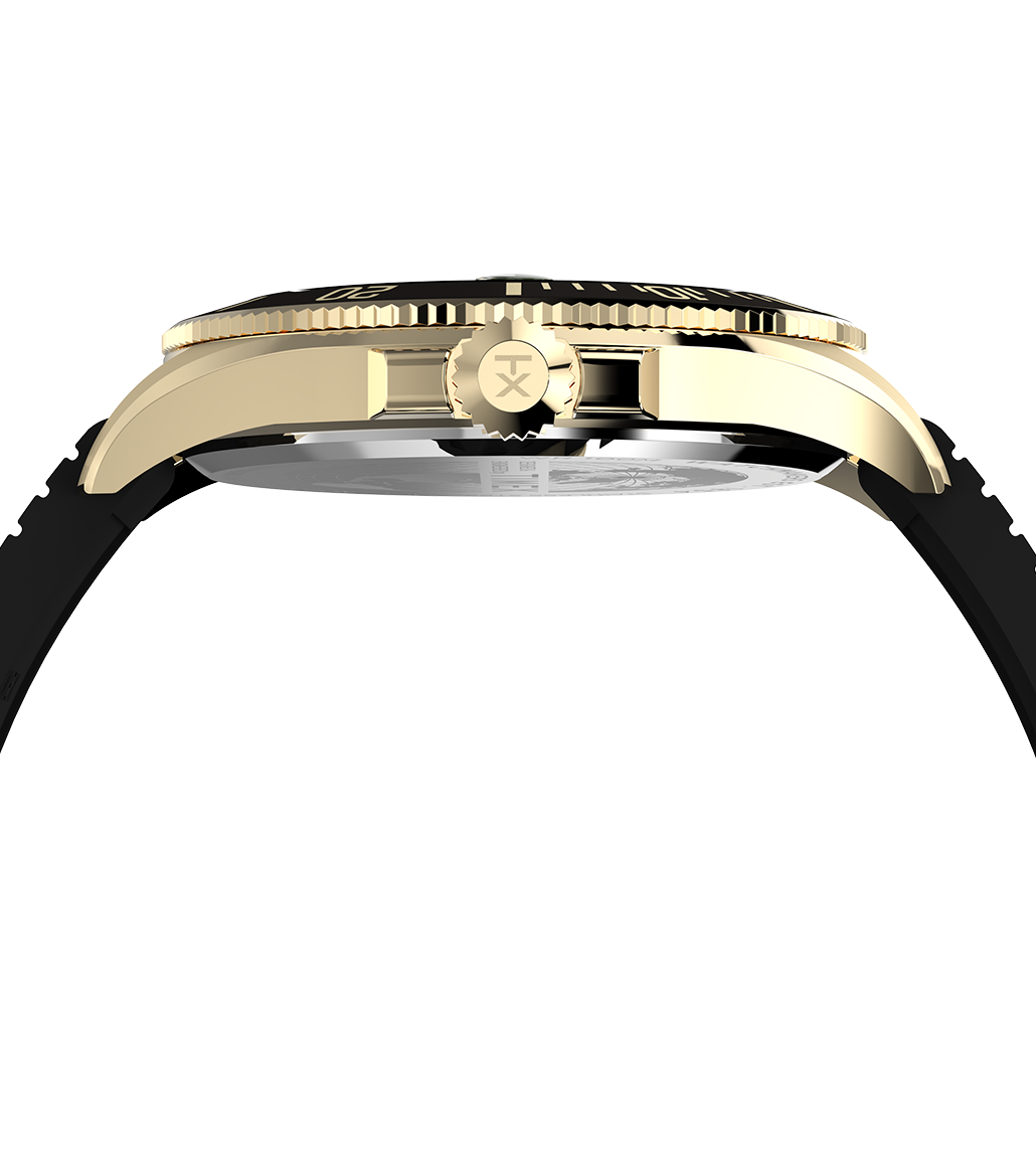 Side profile view of the Timex Harborside Coast watch showing its polished gold-tone stainless steel case, black rotating bezel, and the crown engraved with the Timex “TX” logo. The strap connects seamlessly to the sleek, contoured case.