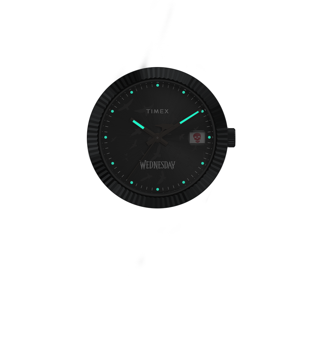 View of the Timex x Wednesday Legacy watch in a low-light setting, highlighting the glow-in-the-dark hands and hour markers with teal illumination against the dark dial.
