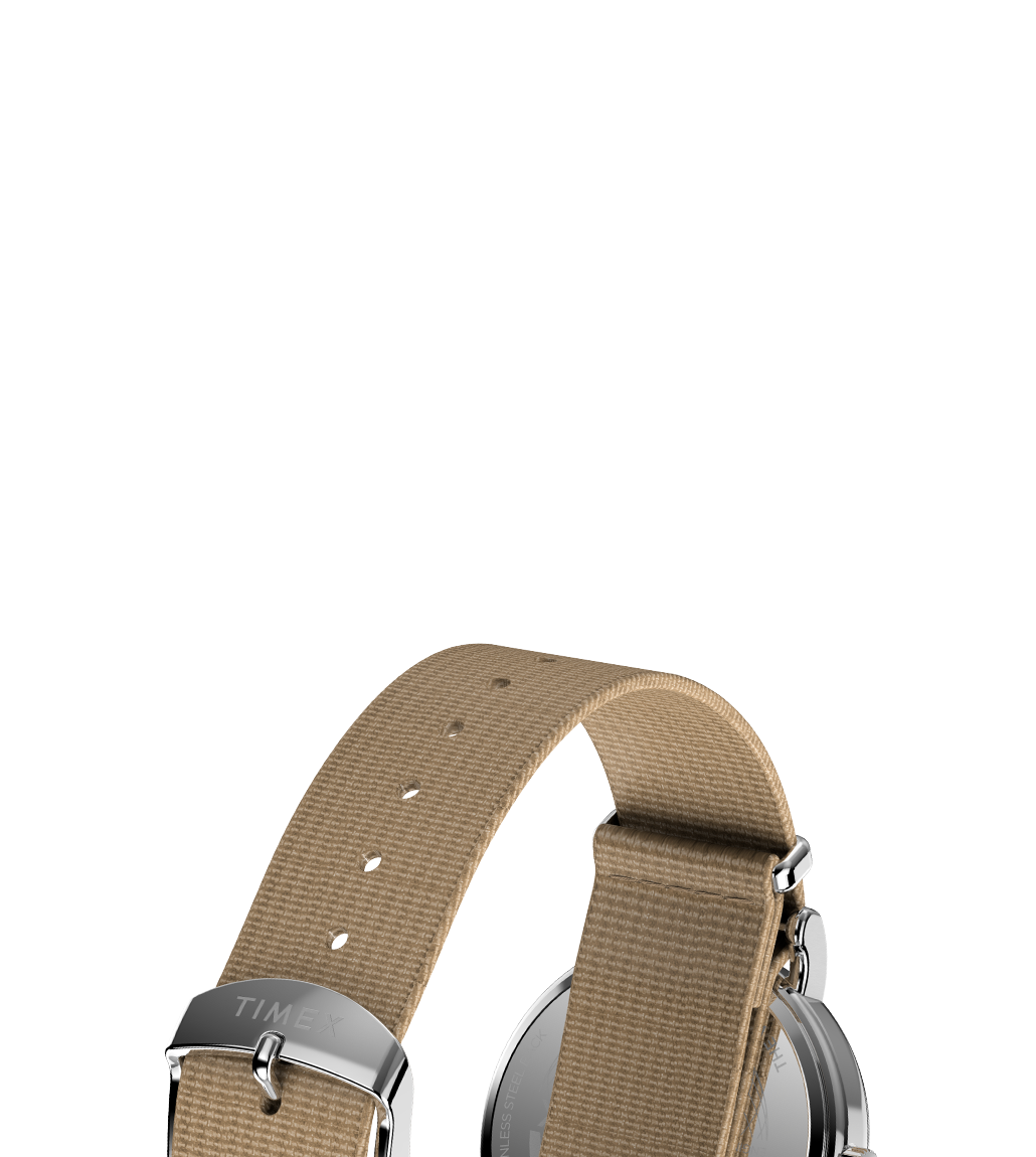 Detail view of the sand-colored nylon strap of the Weekender 37mm from the back, highlighting the stainless steel buckle engraved with the Timex logo.