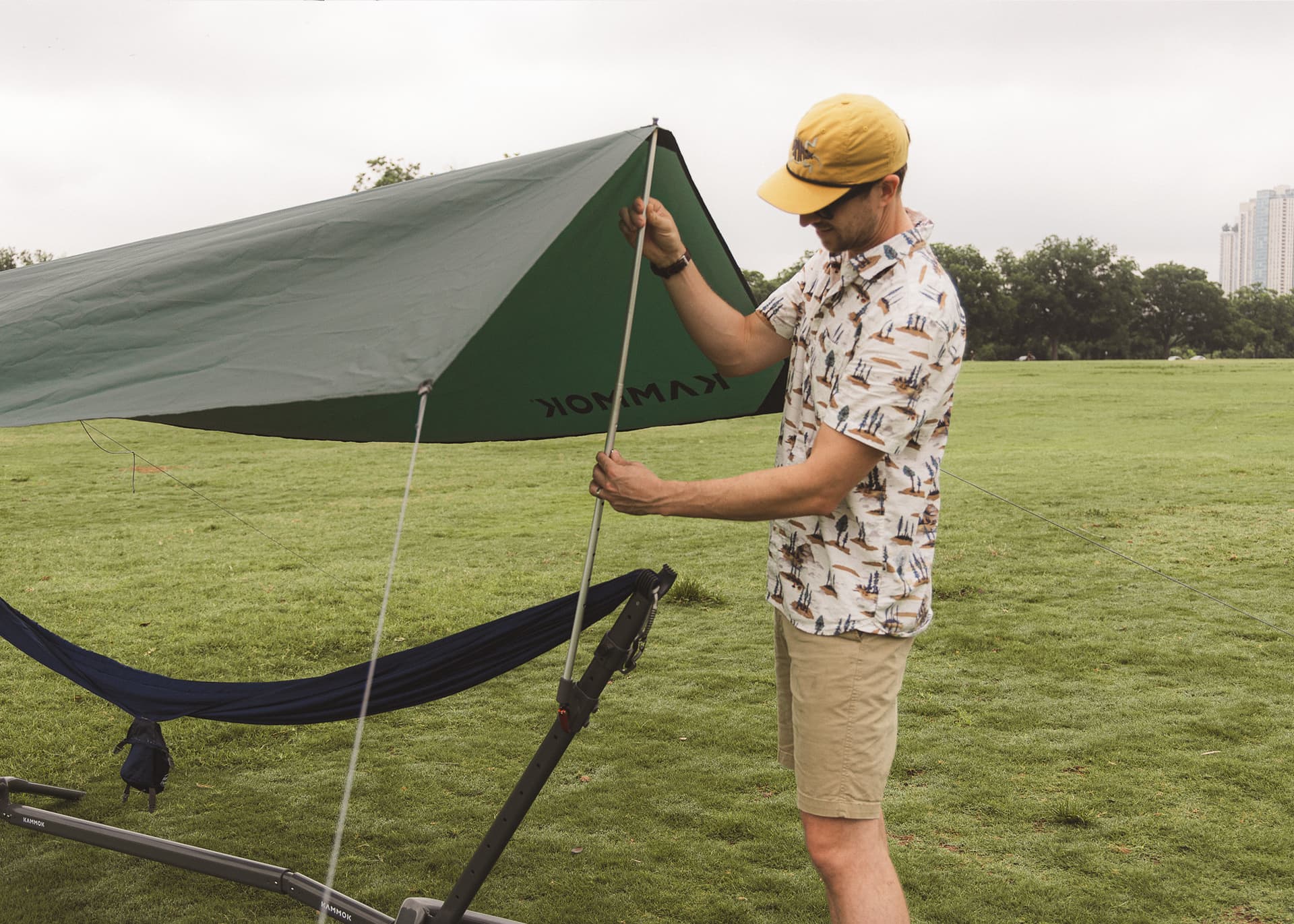 Man adjusting shade on Swiftlet Shade Kit.