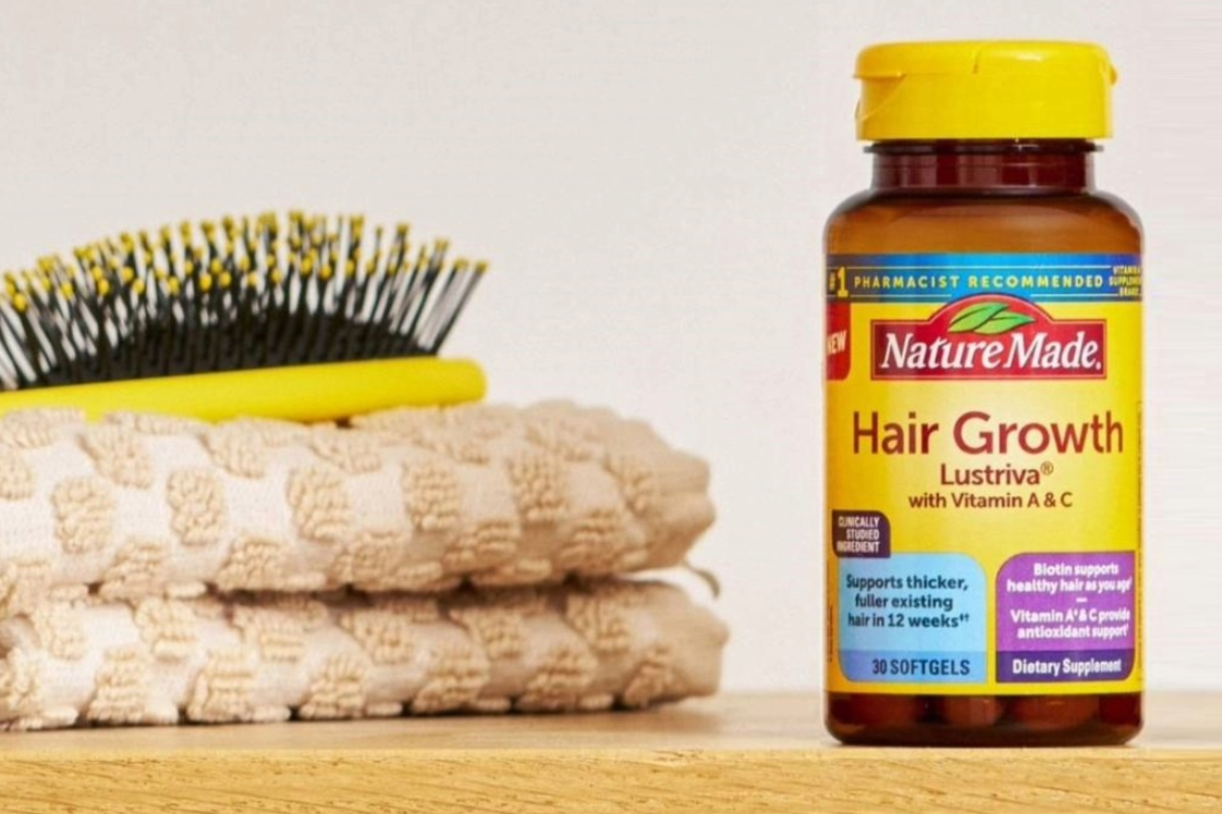 Nature Made Hair Growth supplement bottle on bathroom vanity
