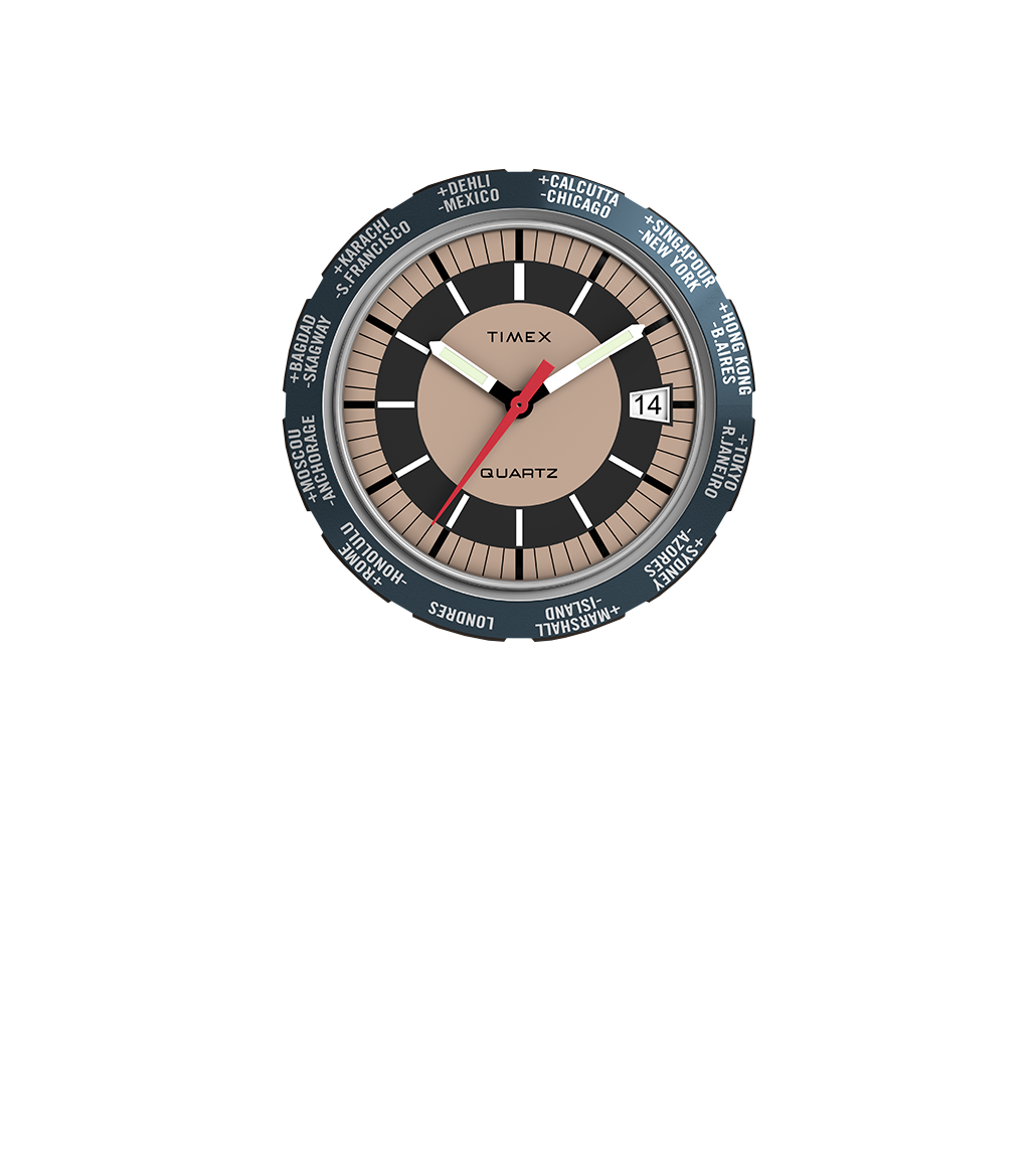 Top-down close-up of the Q Timex® 1972 World Time watch face. The dial displays a bronze center, black inner ring, and beige outer ring with bold hour markers, surrounded by a world time bezel labeled with city names for global timekeeping.