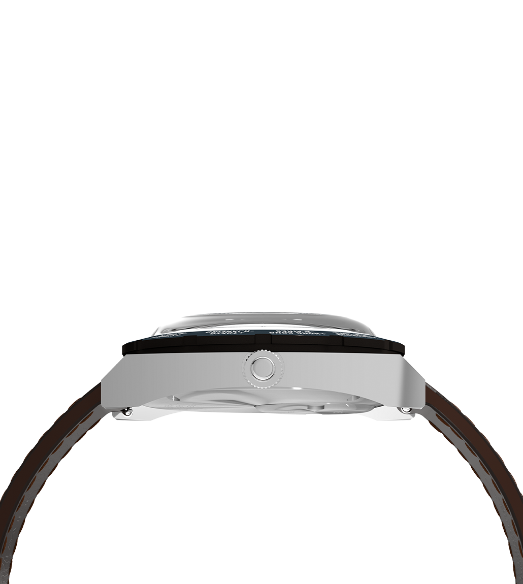 Side profile view of the Q Timex® 1972 World Time watch showing the stainless-steel case, domed crystal, crown, and the brown leather strap curving around the wrist.