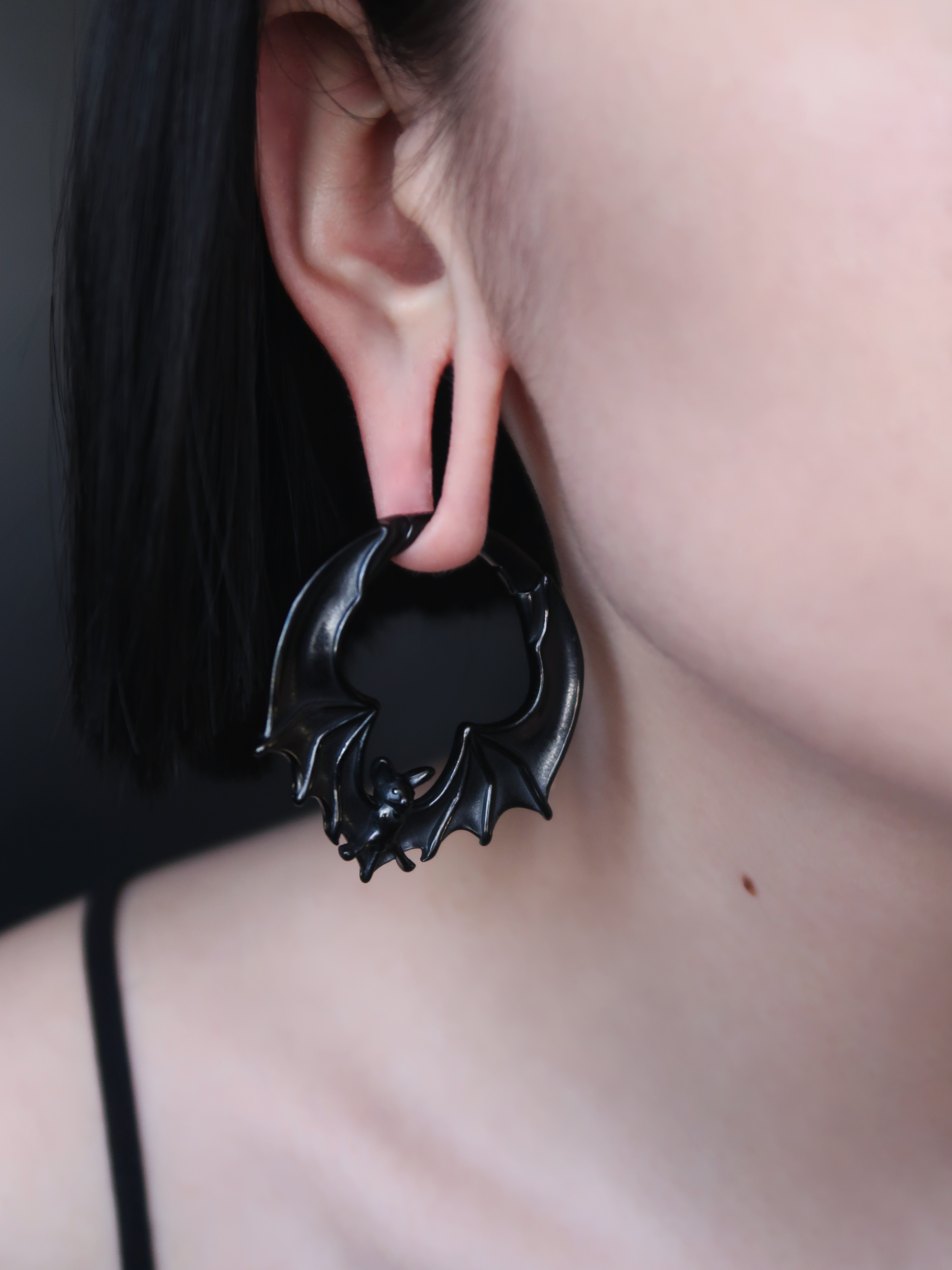 Girl wearing pretty  Black Bat Ear Weights (Pair)