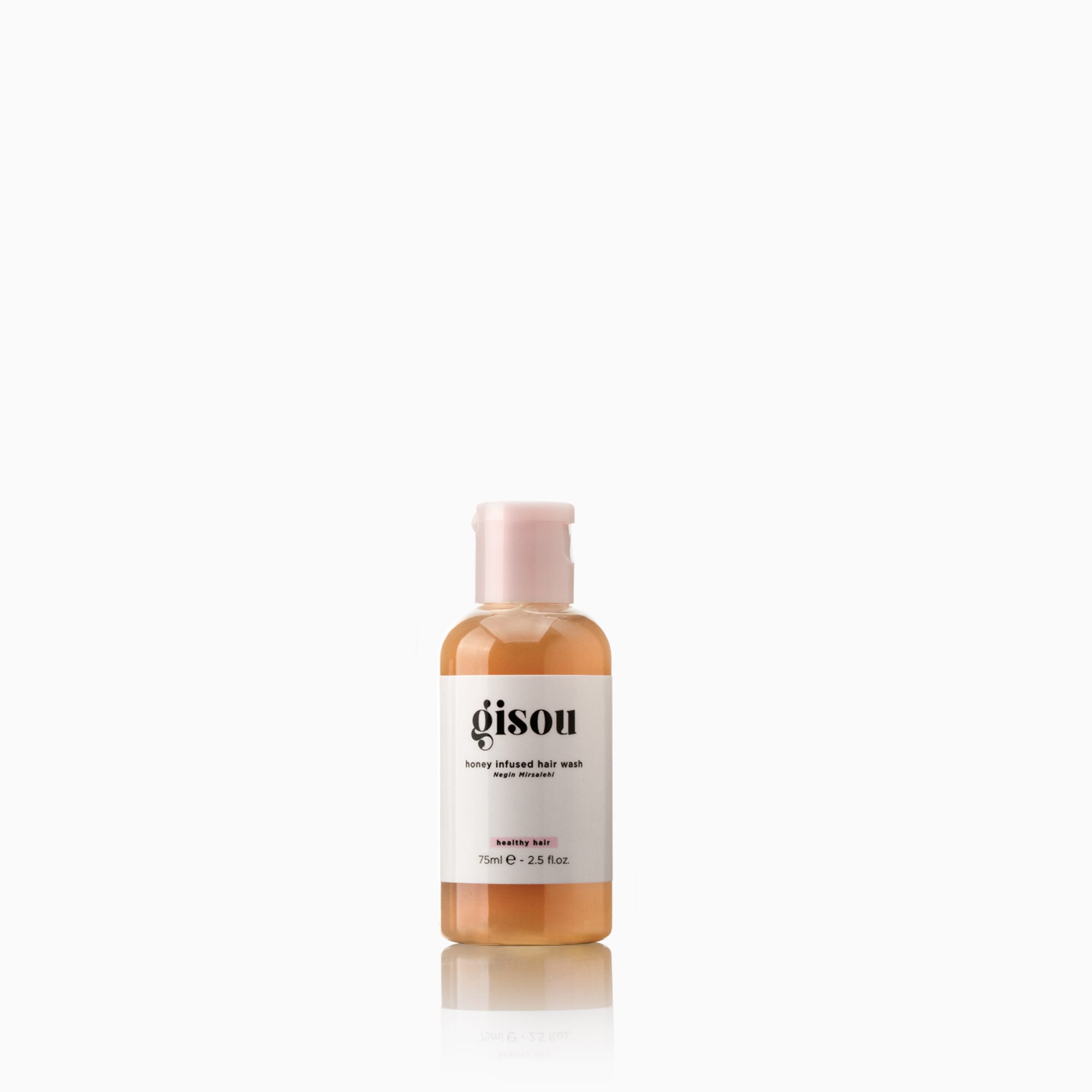 A bottle of Honey Infused Hair Wash Mini