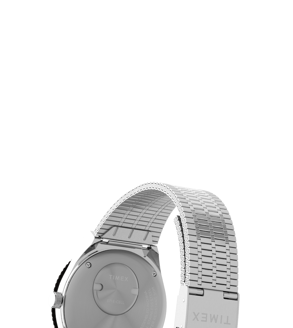 Rear view of the Timex x seconde/seconde/ watch highlighting the polished stainless steel caseback and flexible expansion-style bracelet. The caseback is engraved with branding and battery type information, and the 'TIMEX' logo is stamped on the clasp.