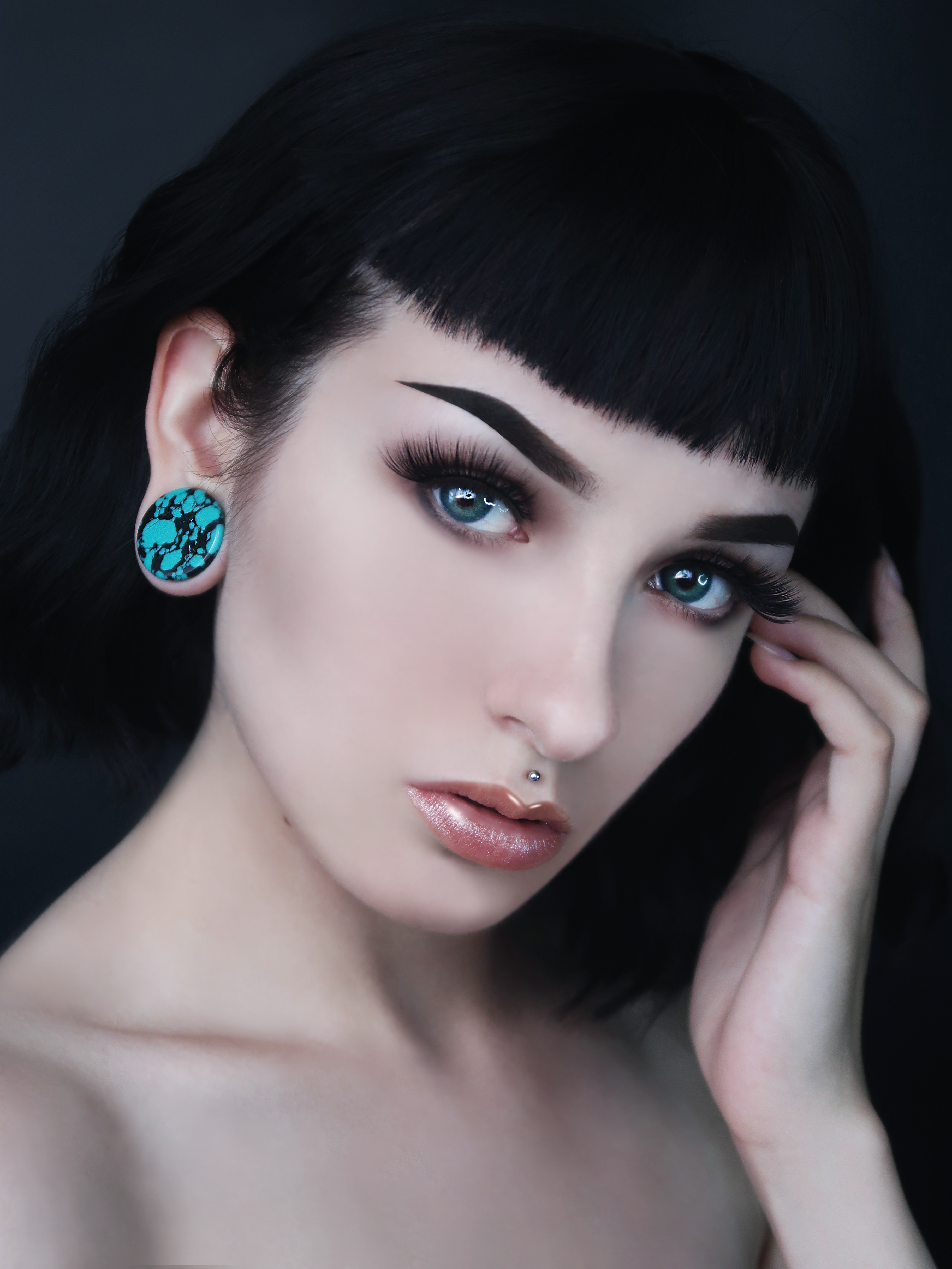 Girl wearing pretty  Black & Teal Turquoise Stone Plug / Gauge