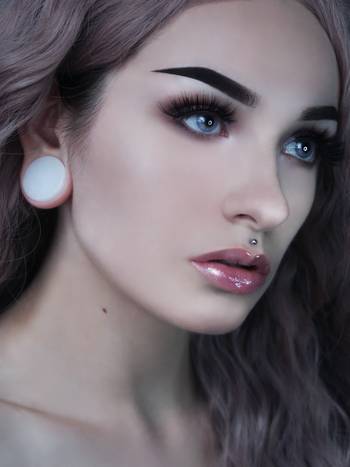 Girl wearing cute White Jade Stone Plug / Gauge
