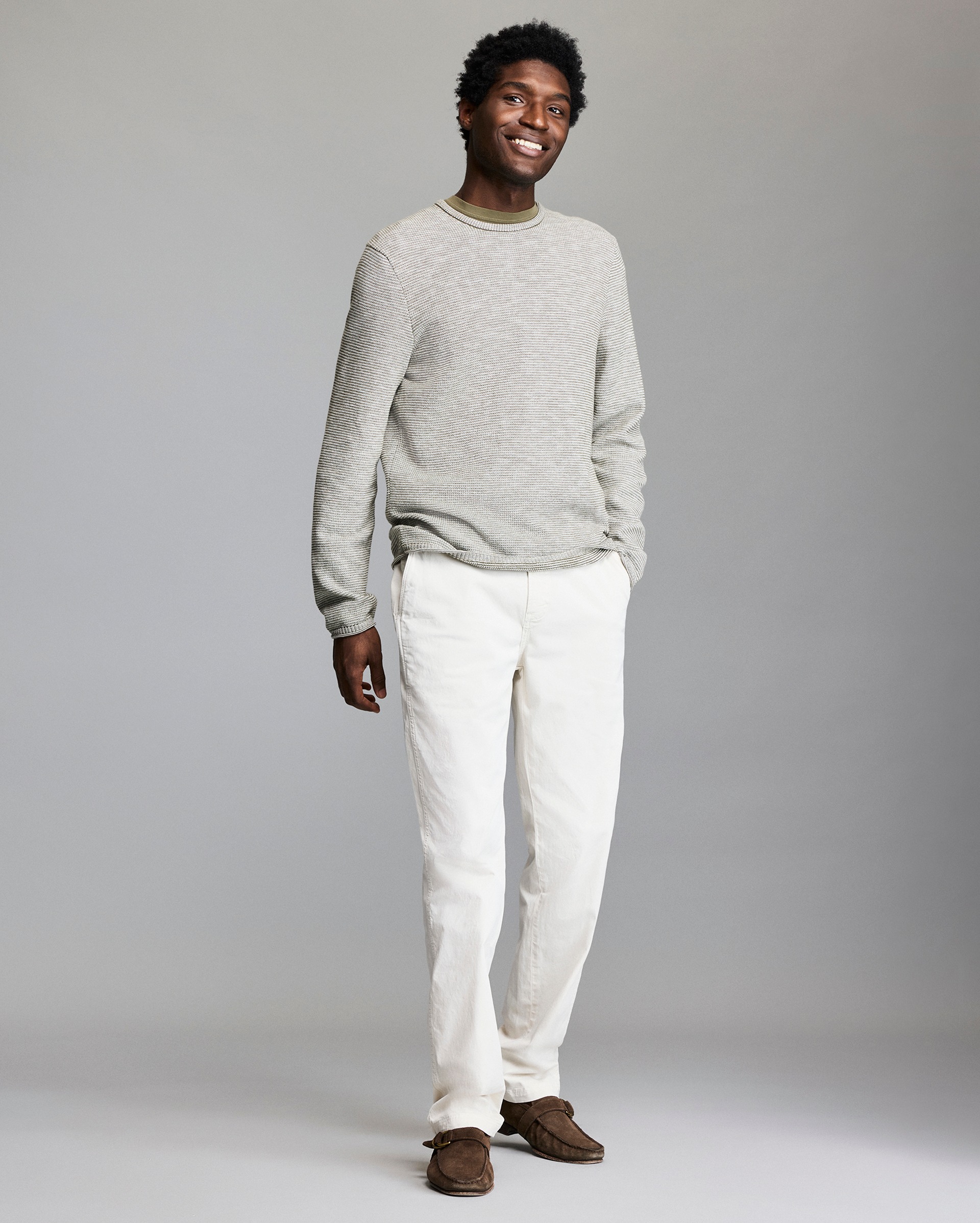 Model shows the fit of the sweater.