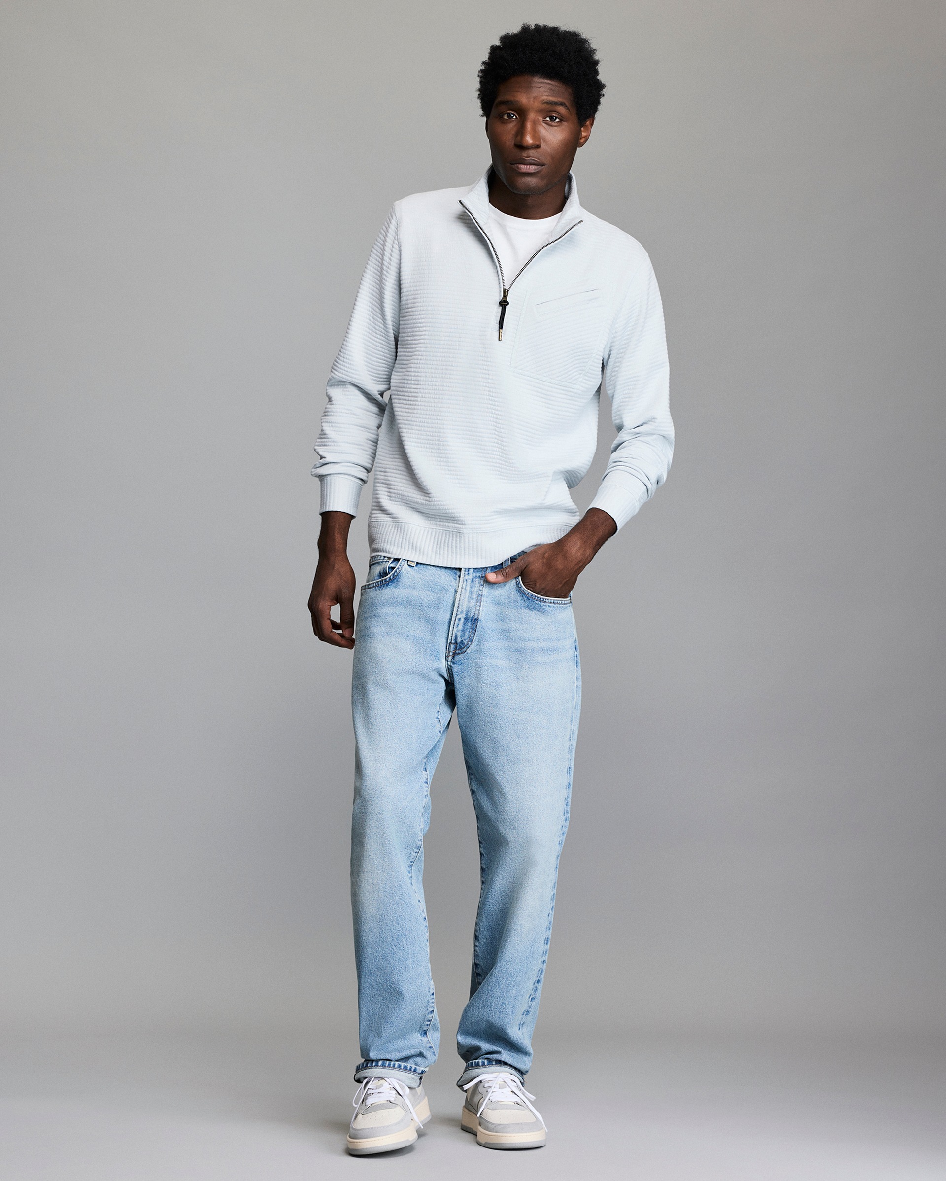 Model shows the fit of the half zip.