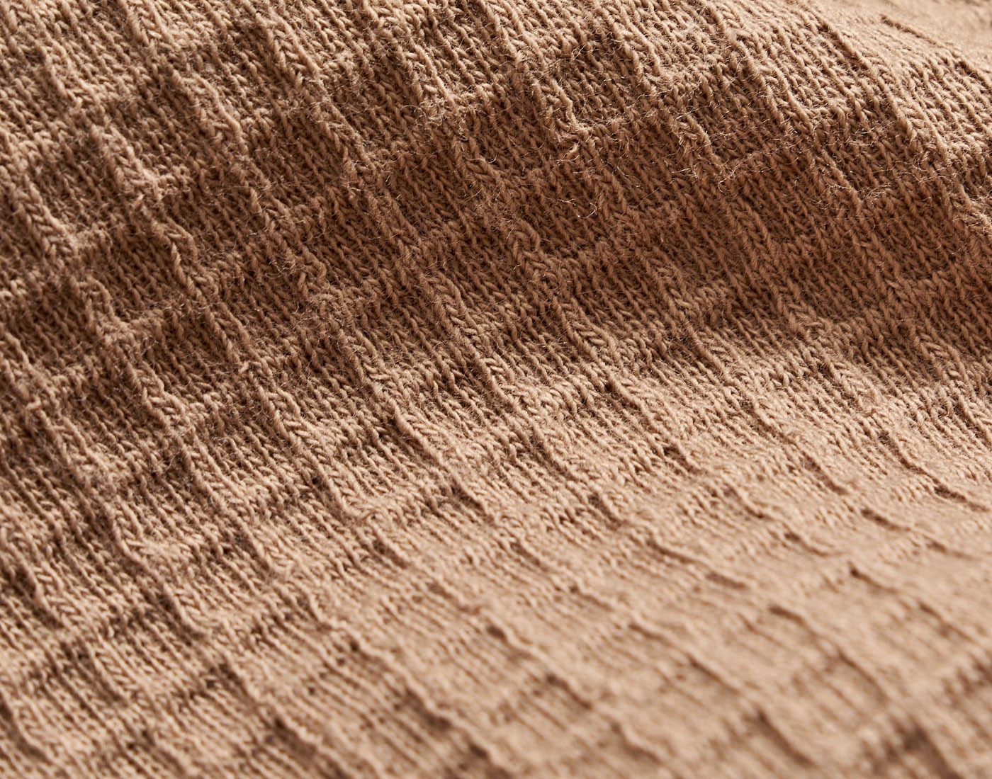 Close up of the grid knit fabric.