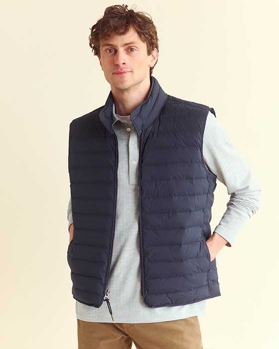 Male model wears the baffle vest