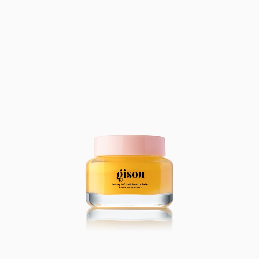 A jar of Honey Infused beauty balm on the white background