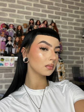 Girl wearing cute White & Black Marble Effect Silicone Ear Tunnel