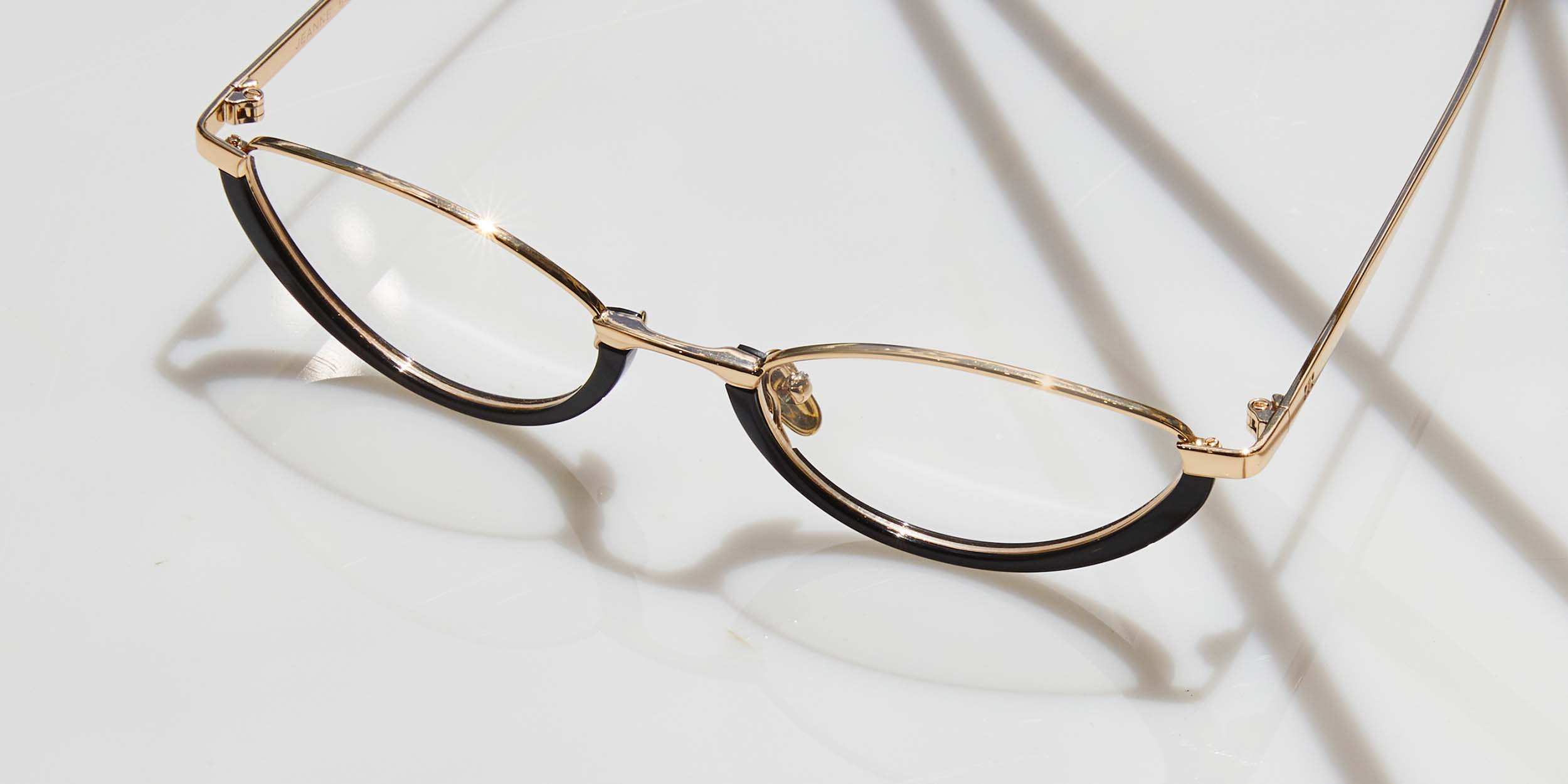 Photo Details of Jeanne Cream & Gold Reading Glasses in a room